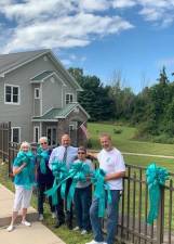 Pictured from left to right are volunteer members of the Turn the Towns Teal Campaign: Kathy Colquhoun, Colleen Farrell, Monroe Town Supervisor Tony Cardone, Sandy Daly and Greg Colquhoun. See related letter to the editor on Page 12.