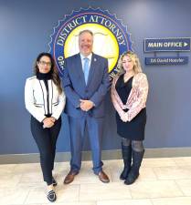 District Attorney David Hoovler stands between Assistant District Attorneys Amanda Bettinelli<b> </b>and Christine Maggiore.