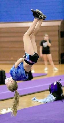 Audrey Whitfield shows off her tumbling skills.