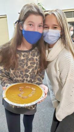 CTeen members Molly Berman of Warwick and Yirshalem Pinkus of Sugar Loaf hold their “heart pumpkin pie” that they made to help community members in need at Chabad of Orange County’s Center in Chester. Photos provided by Chabad of Orange County.