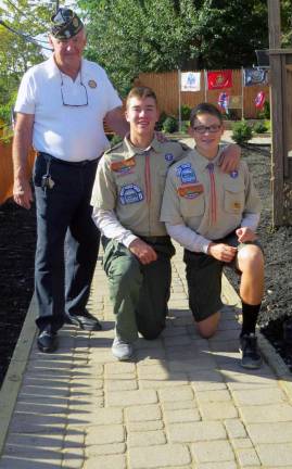 Post 488 Legion Past Commander Marty Currid with Anthony Salatto and Matthew Salatto on the paver walkway which was part of Anthony Salatto's Eagle Scout project.