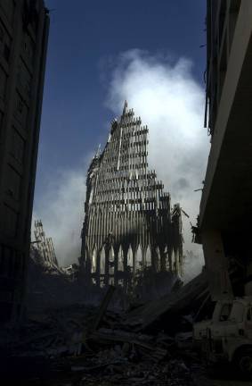 (Sept. 14, 2001) -- What is left of the south tower of the World Trade Center in New York City, stands like a tombstone among the debris and devastation caused by the Sep. 11 terrorist attack. U.S. Navy photo by Journalist 1st Class Preston Keres.