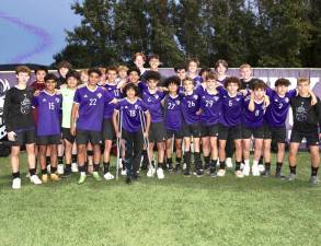 The 2023 Crusaders varsity soccer team celebrates their seniors after the game.