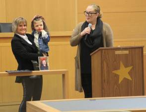 Orange County Court Judge Christine Krahulik holds Aniyah Dittbrenner of Pine Bush at Friday’s Adoption Day ceremony. Looking on is Aniyah’s mom, Shannon Dittbrenner, who adopted Aniyah, 5, in 2021.