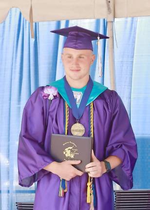 Anthony Bruno, Monroe Woodbury Class of 2020 Valedictorian, receives his diploma on Wednesday afternoon.