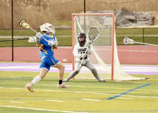 Crusader goalie Tyler Baisley, #15, kept the Crusaders in the game with some great saves.