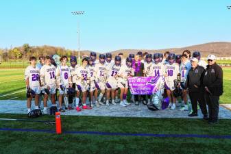 The Crusaders celebrate head coach Steven Brown’s 150th victory as head coach of the boys’ lacrosse team.
