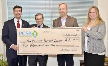 Pictured from left to right are PCSB Bank Senior Vice President, Retail Banking Officer &amp; Director of Cash Management Services Dominick Petramale; PCSB Chairman, President &amp; CEO Joseph D. Roberto; Food Bank of the Hudson Valley Director Paul Stermer; and PCSB Senior Vice President, Business Development Manager Robin Hulmes.