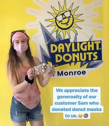 Samantha Larkin recently cheered up the staff of Daylight Donuts in Monroe by giving them donut-patterned masks to wear in the shop.