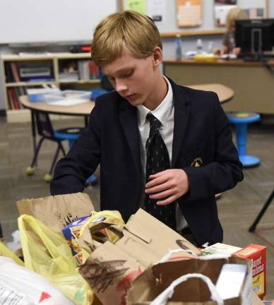 Tuxedo Park School eighth-grader Wade Mattingly of Warwick also was part of the community service project to support the Tuxedo School District&#x2019;s BackPack program.
