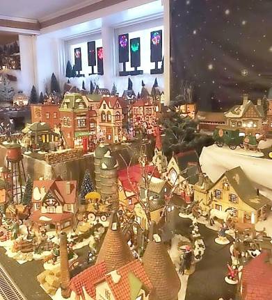 A Highland Mills family has created an elaborate display of 325 miniature holiday buildings and is inviting the community to view.