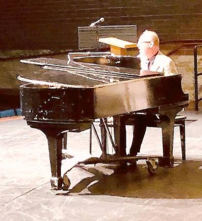 Retired M-W choral music teacher Steven Wing plays and sings Jimmy Webb’s “If These Walls Could Speak” at the recent M-W Faculty and Friends Concert.
