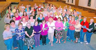 Members of the Warwick Valley Chorale pause for this photograph during a rehearsal at the Warwick Reformed Church. Photo by Ed Bailey.