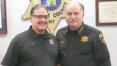 Officer David Colon (left) with Sheriff Carl DuBois