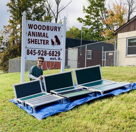 David Pomerantz with the dog beds he made for his Eagle Scout project