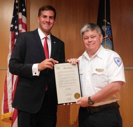 Assemblyman Colin Schmitt recognized Ben Conques for his 38 years of service with Woodbury Community Ambulance.