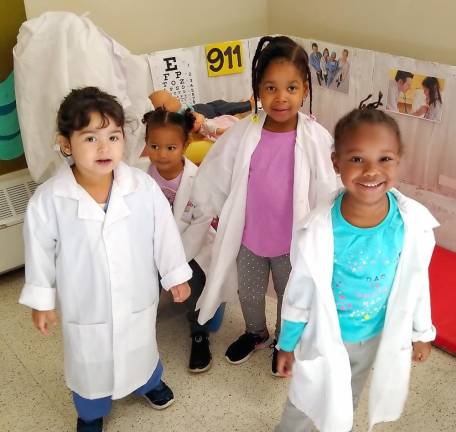 Doctors Adrielle Kunkel , Genesis Bazelais, Arianna Jean Baptiste and Grace Rodgers of Ms. Katrina Powers' class make rounds at the hospital.