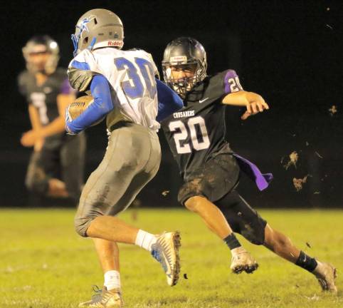 Linebacker Anthony Piazza (#20) chases down a Viking runner.