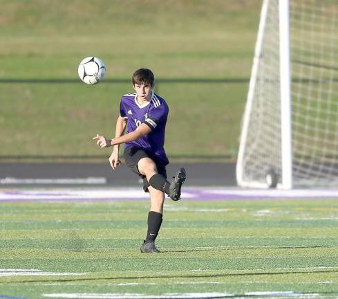 Senior captain Jesse Schwartz clears the ball out of the Crusaders defensive zone.