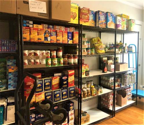 Full shelves at the First Presbyterian Church of Monroe's food pantry.