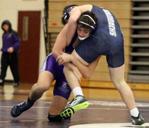 Photos by William Dimmit At 170 lbs., John Minnies started a streak of four pins in a row by the Crusaders when he pinned Maxx DeCapua in 3:15.