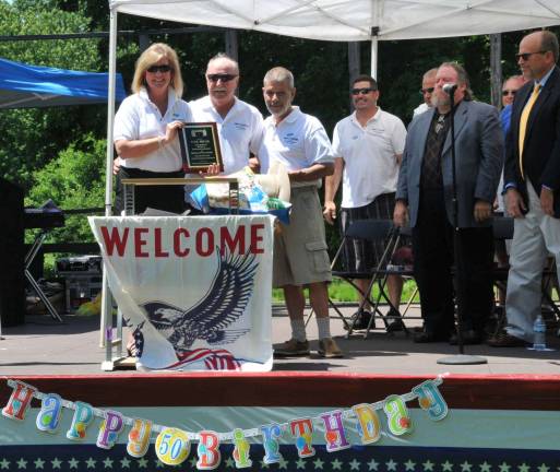 Photos provided by Joe Manscuso As part of the 50th anniversary of Smith&#xfe;&#xc4;&#xf4;s Clove Park&#xfe;&#xc4;&#xf4;s dedication, the Monroe Joint Parks and Recreation Commission present ed Paul Truax an award in recognition of his service.