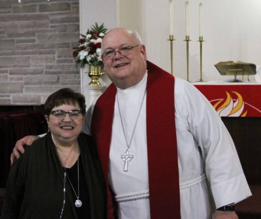 Pastor Robert C. Wilson with his wife, Rochelle, at his ordination and installation service at St. Paul Lutheran Church in Monroe on Jan. 14.