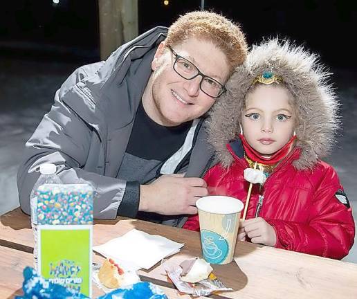 Konstantin Zaliznyak of Monroe and his daughter, Amelia, 5, at Chabad’s Purim in the Arctic held outdoors at the American Legion Hall and Pavilion in Monroe.