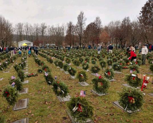 Provided photos Approximately 3,000 wreaths were laid during the Wreaths Across America ceremony by more than 200 volunteers at the 19-acre Veterans Memorial Cemetery in Goshen last Saturday.