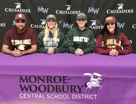 Photo by William Dimmit Pictured from left to right are Monroe-Woodbury student-athletes Andrew Jemison, Kayla MacKenzie, Kaitlyn Hogan and Angelica Sanchez who signed letters of intent for colleges.
