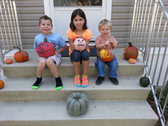 Submitted by April Lowe of Harriman, N.Y. Pictured from left: Matthew Raymond, 6, Faith Buckley, 8, and Liam Lowe, 2, all of Harriman, N.Y. show off their artistic talent on their Halloween pumpkins.