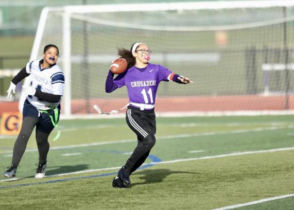 Quarterback Chloe Ahorrio, #11, scored five touchdowns during the game, with four passes and one run.
