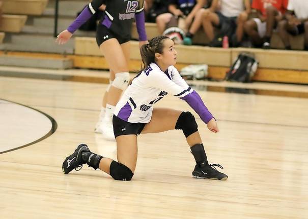 Catenna Schiff slides into one of her 14 digs