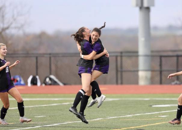 Crusaders Natalie Harwood (left) and Madison Gollinger (right) react to Harwood’s goal late in the first half.