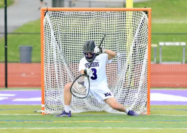 Senior goalie Dean Pesce kept the Wizards off the score board. Photos by William Dimmit.