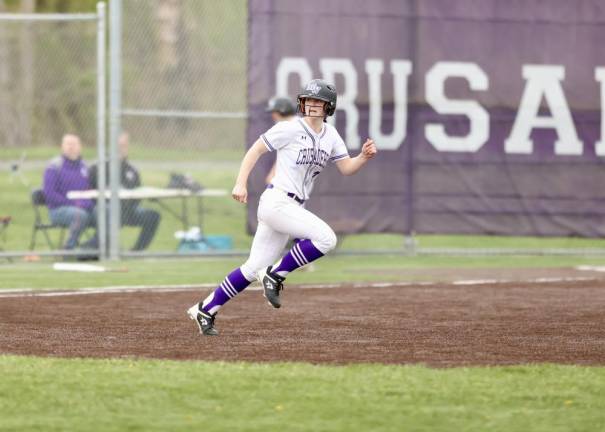 Crusader center fielder Erin Coyle runs to second after her RBI double in the third.