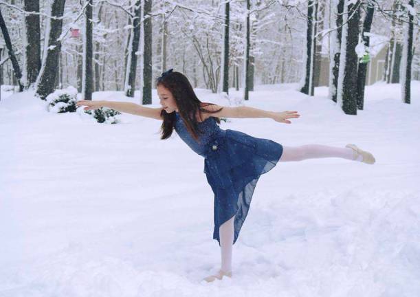 Photo provided What to do on a snowy, day off from school? Maddy Rita of Monroe, a student at Terpsichore the Dancerschool in Monroe, put on one of her costumes for some spur-of-the-moment snow dancing in her backyard.