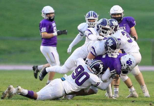 The Crusader defense brings down the Wildcat quarterback for a loss.