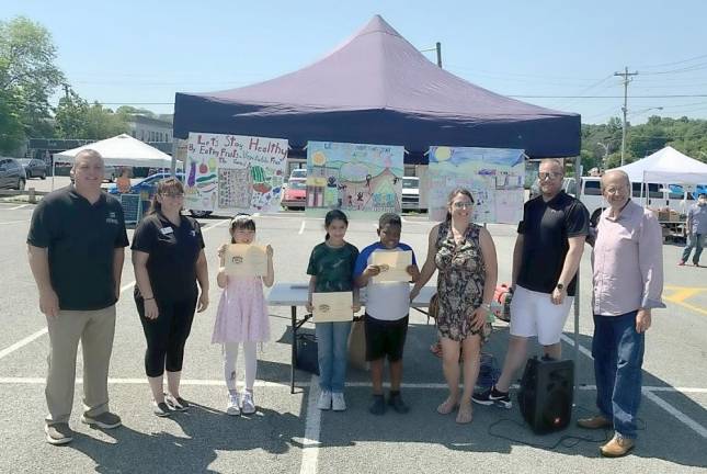 Monroe Village officials with the winners of the health and wellness poster contest from Pine Tree Elementary School. Photos provided by the Village of Monroe/Trustee Dorey Houle.