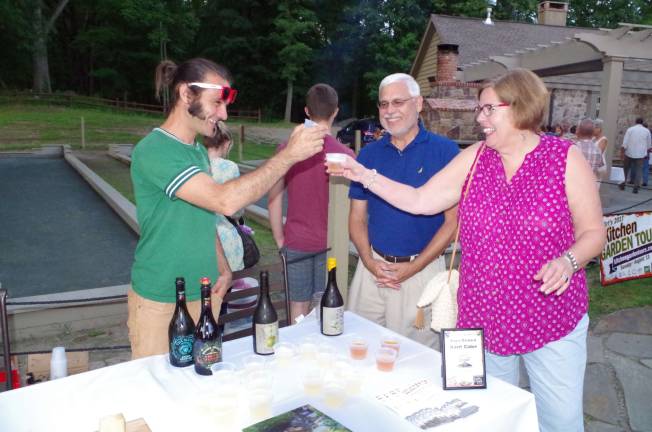Attendees toasting at last year's Kitchen Garden Tour after party at Mohawk House.