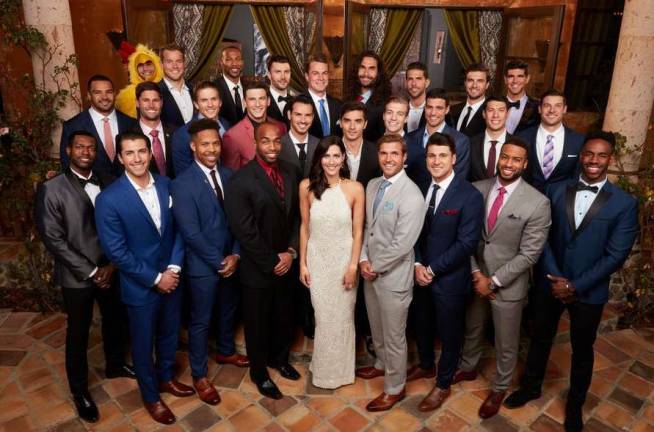 Photo via ABC&#x2019;s &#x201c;The Bachelorette&#x201d; website Monroe resident Kamil Nicalek with the full cast of Season 14 of &#x201c;The Bachelorette.&#x201d; (Yes, one of the cast members is wearing a chicken suit.)