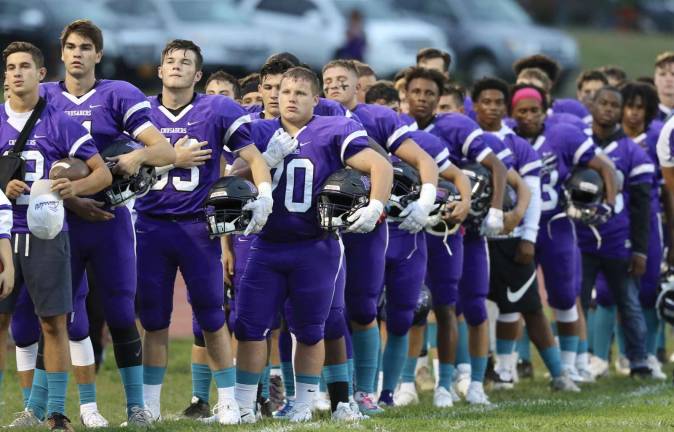 Photos by William Dimmit Crusaders stand at attention for the National Anthem at their home opener.