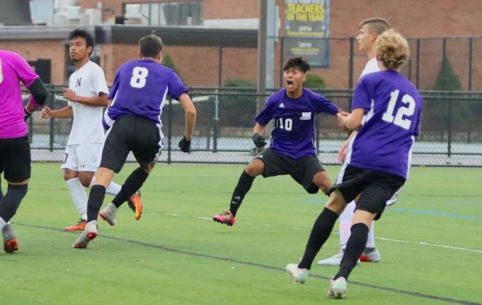 Photos by William Dimmit Christ Valle (#10) reacts to (#8) Joseph Olivette&#x2019;s goal off a set play early in the game.
