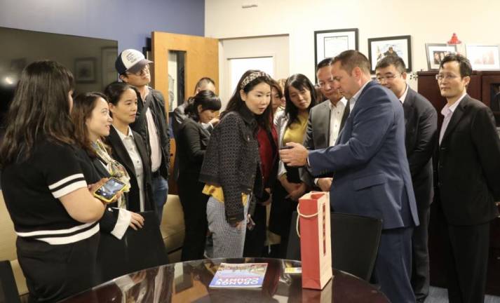 County Executive Steve Neuhaus talks to visitors from Xi'an.