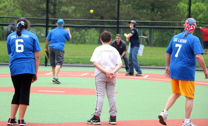 The players were paired with &#x201c;buddies&#x201d; who assisted them as they hit, round the bases and fielded the balls.
