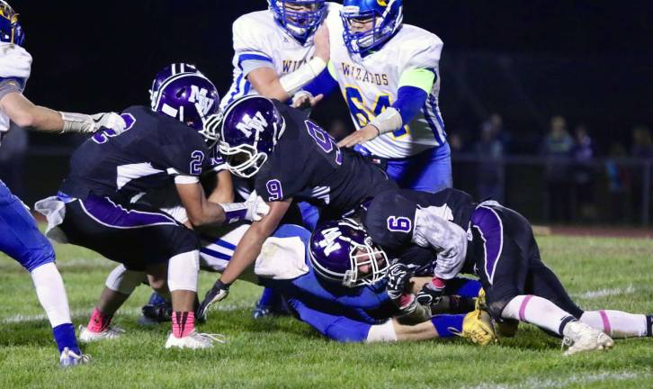 Defense: Crusaders Jeremy Ocasio (#2), Christian Toribio (#9), and Roberts Mikelsons (#6) swarm all over a Wizard ball carrier.