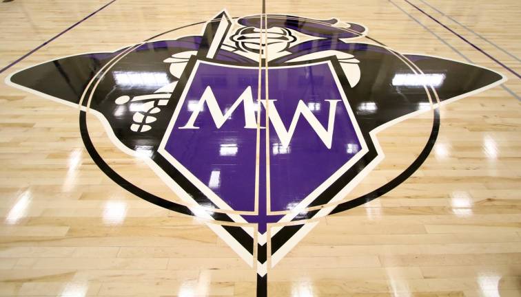 The new Crusader logo has been added to center court .