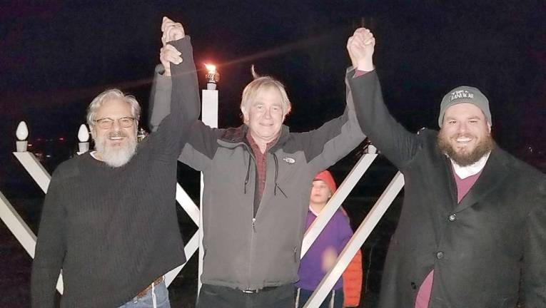 United in Light: Tuxedo Town Supervisor Ken English, center, pictured with Chabad’s Rabbi Pesach Burston, right, and Chabad Gabbai Ira Kanis of Monroe, left, after lighting the menorah in Tuxedo on Dec. 26.