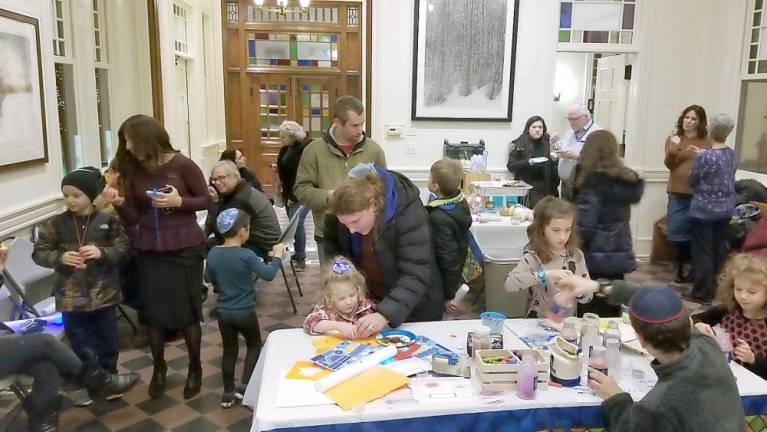 The Hanukkah reception held in the community room at the Tuxedo Train Station included children’s crafts, hot cocoa, doughnuts, latkes and schmoozing.