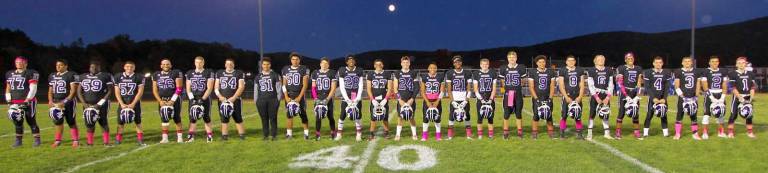Photos by William Dimmit The Crusaders seniors take part in the pre-game ceremony.